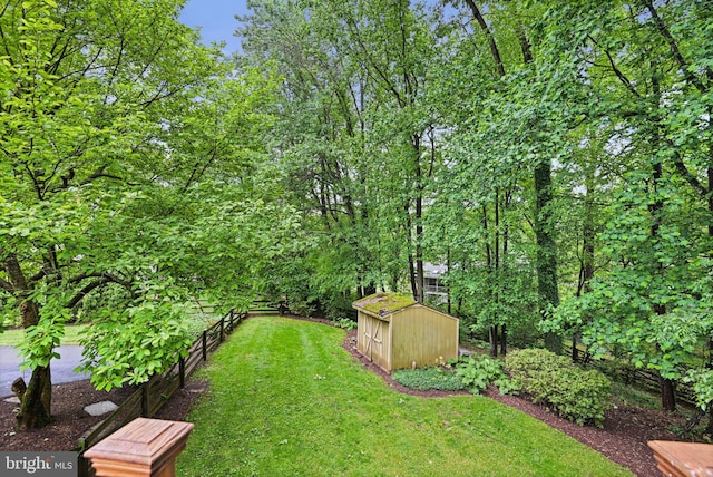 1716 Saddle Ridge Ct, Vienna, VA 22182 - view of green lawn with a shed and an outdoor structure