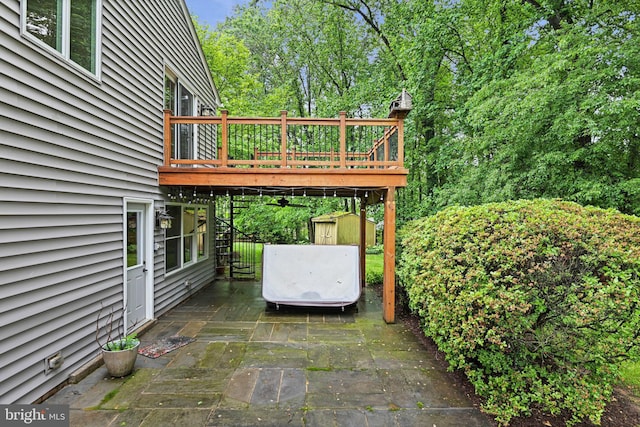 1716 Saddle Ridge Ct, Vienna, VA 22182 - view of patio / terrace with a storage shed, a deck, and an outdoor structure