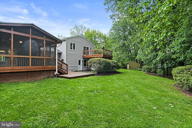 1716 Saddle Ridge Ct, Vienna, VA 22182 - view of grassy yard with a storage unit, a deck, a sunroom, and an outbuilding
