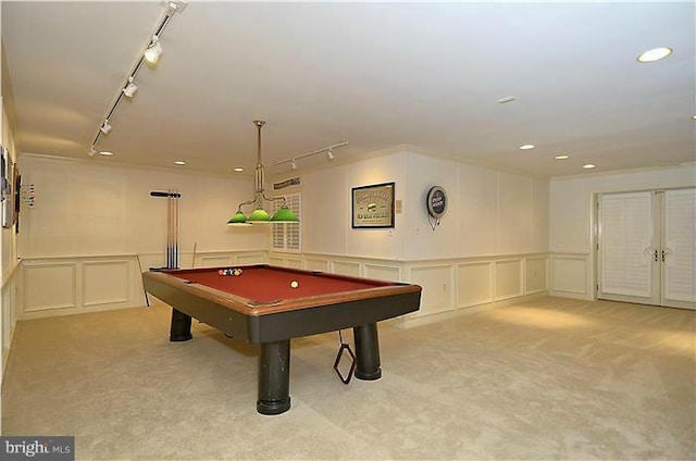playroom featuring track lighting, light carpet, a decorative wall, a wainscoted wall, and billiards