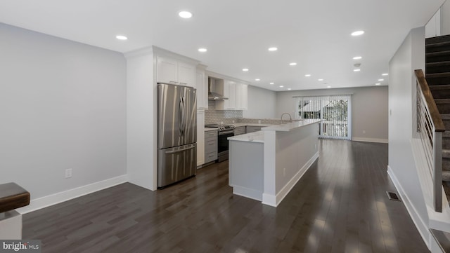 39 Oakmont Pl, Media, PA 19063 - kitchen featuring appliances with stainless steel finishes, wall chimney exhaust hood, white cabinetry, a peninsula, and dark wood-style floors