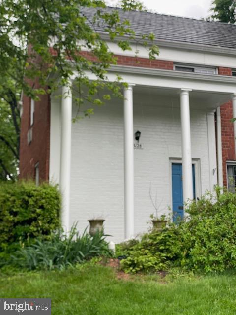 view of property exterior with brick siding