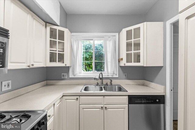 3128 Martha Custis Dr, Alexandria, VA 22302 - kitchen with dishwasher, a sink, white cabinets, stove, and light countertops