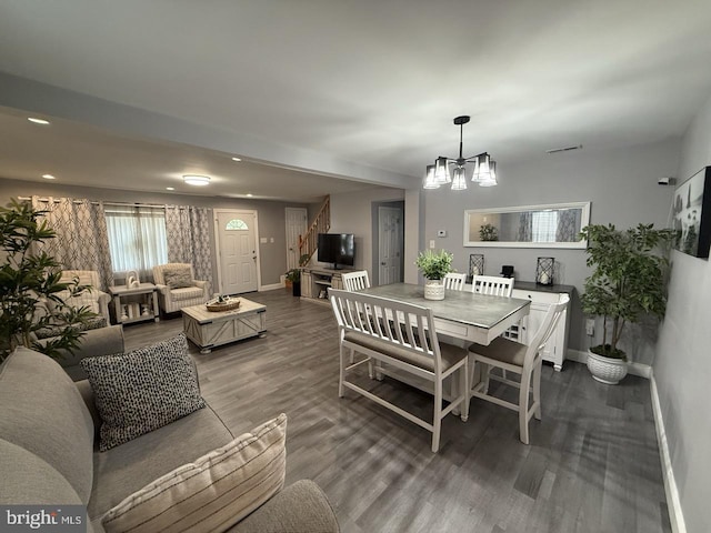 dining room featuring visible vents, an inviting chandelier, wood finished floors, baseboards, and recessed lighting