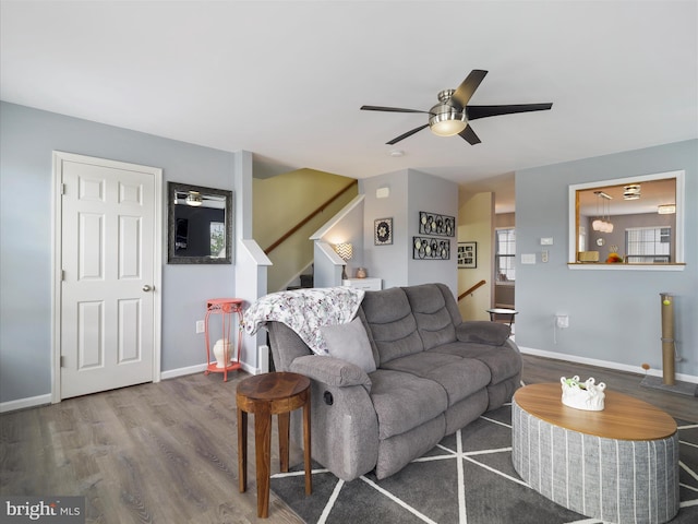 1161 Steed St, Ranson, WV 25438 - living room featuring a ceiling fan, wood finished floors, baseboards, and stairway