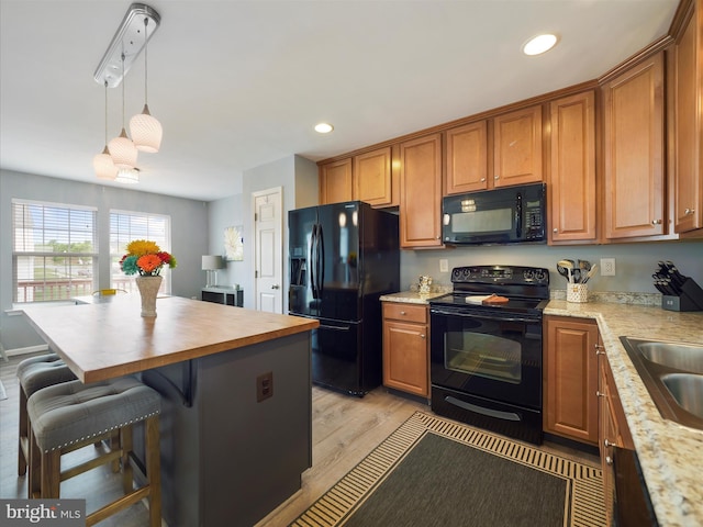 1161 Steed St, Ranson, WV 25438 - kitchen featuring black appliances, light wood-type flooring, recessed lighting, butcher block counters, and brown cabinetry