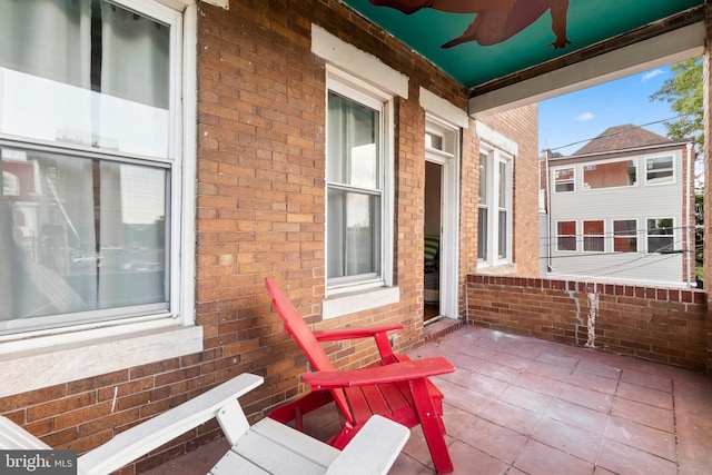view of patio / terrace with a porch and a ceiling fan
