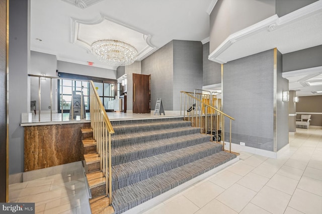 staircase featuring baseboards, tile patterned floors, and a chandelier