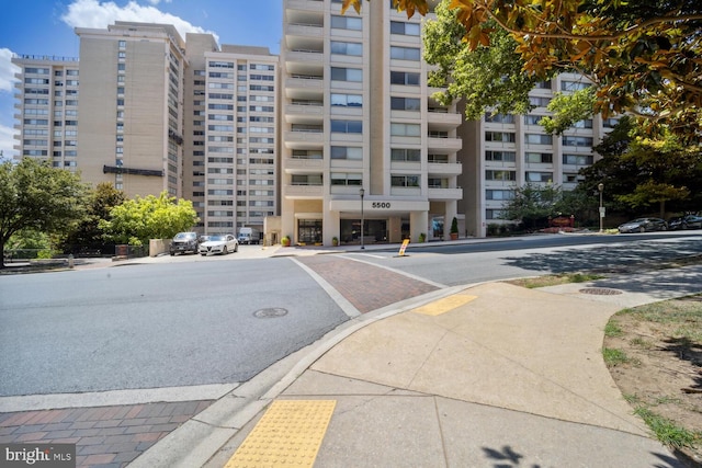 view of building exterior with uncovered parking