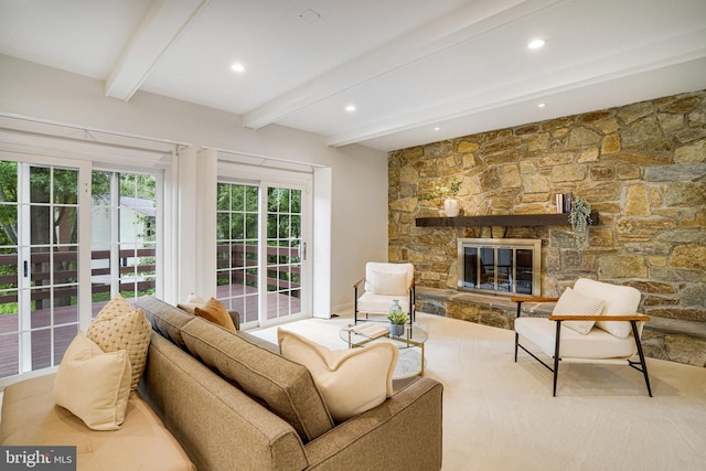 living room with beam ceiling, recessed lighting, and a fireplace