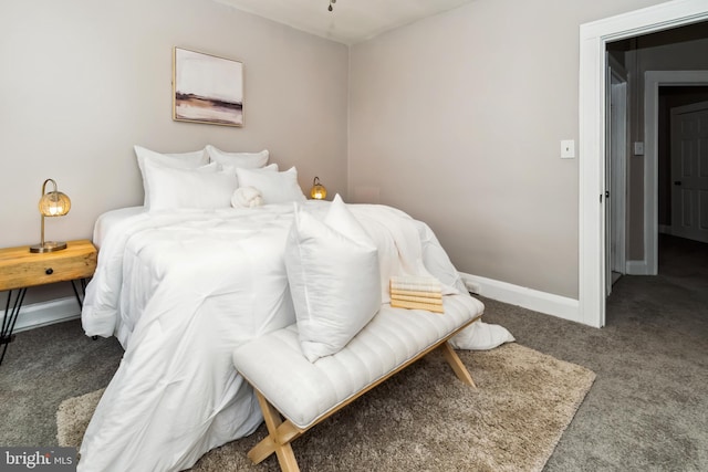 carpeted bedroom with baseboards