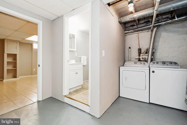 washroom with washing machine and dryer