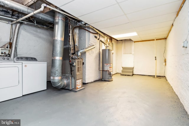 unfinished below grade area with gas water heater and washer and dryer