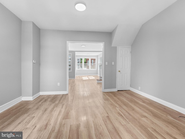 interior space featuring baseboards and light wood-type flooring