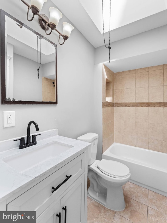 full bath with vanity, tile patterned flooring, toilet, and shower / washtub combination