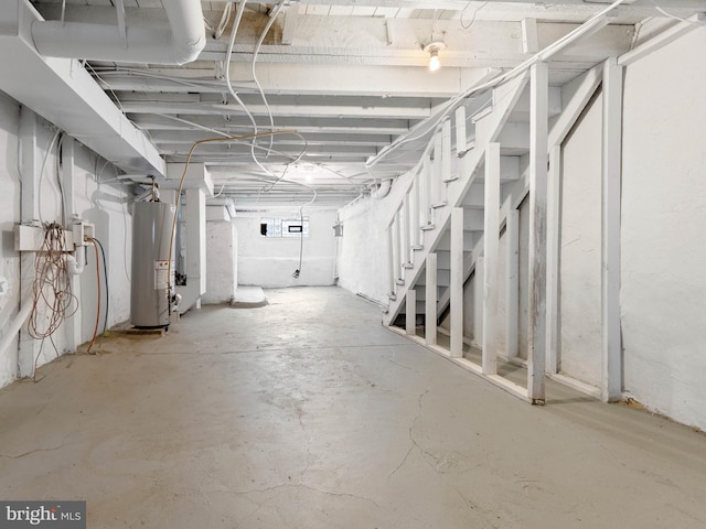 below grade area with stairway and water heater