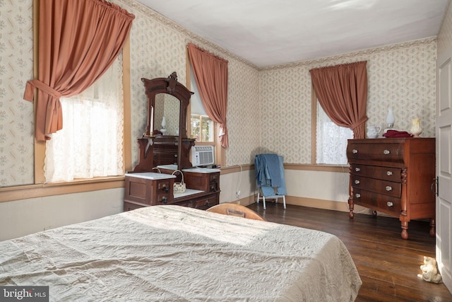 bedroom featuring wood-type flooring, wallpapered walls, and cooling unit