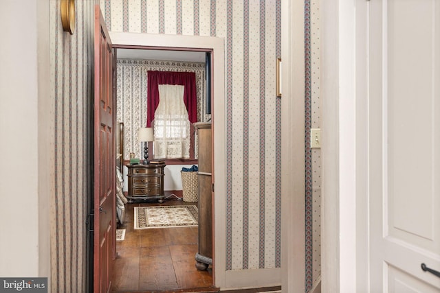 hallway featuring hardwood / wood-style flooring and wallpapered walls