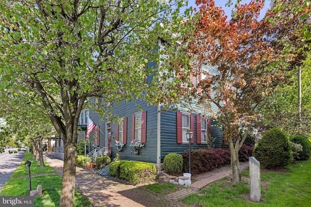 view of home's exterior featuring a lawn