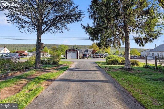 view of front of home featuring a detached garage