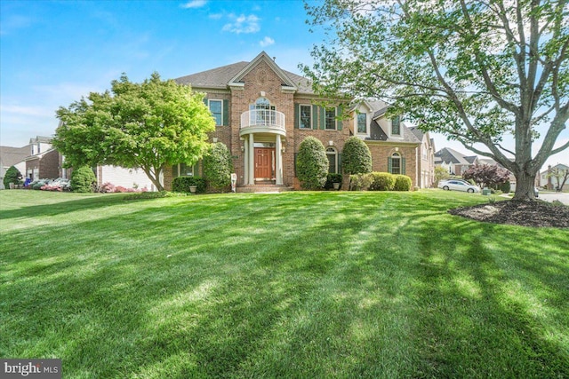 6341 Knollwood Dr, Frederick, MD 21701 - colonial inspired home featuring a front yard and brick siding