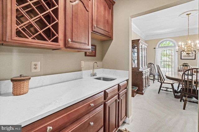 6341 Knollwood Dr, Frederick, MD 21701 - kitchen featuring a sink, ornamental molding, hanging light fixtures, light carpet, and a chandelier