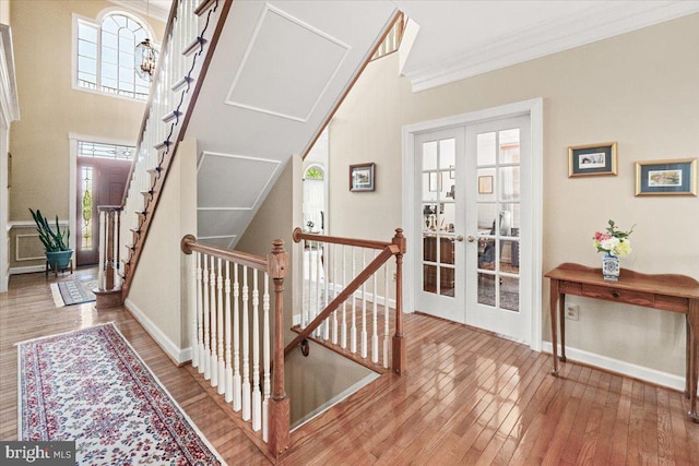 6341 Knollwood Dr, Frederick, MD 21701 - staircase with french doors, baseboards, hardwood / wood-style flooring, and ornamental molding
