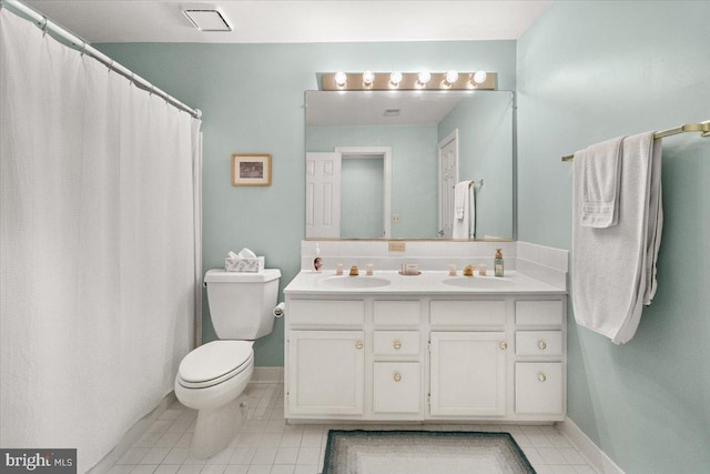 6341 Knollwood Dr, Frederick, MD 21701 - full bath featuring double vanity, toilet, tile patterned flooring, and baseboards