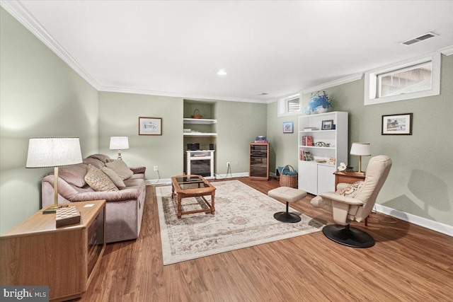 6341 Knollwood Dr, Frederick, MD 21701 - living area featuring crown molding, wood finished floors, baseboards, built in shelves, and recessed lighting