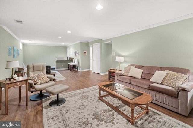 6341 Knollwood Dr, Frederick, MD 21701 - living area with crown molding, wood finished floors, baseboards, and recessed lighting