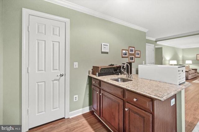 6341 Knollwood Dr, Frederick, MD 21701 - kitchen with a sink, light wood-style flooring, ornamental molding, open floor plan, and a peninsula