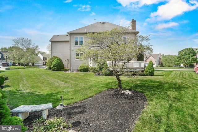 6341 Knollwood Dr, Frederick, MD 21701 - rear view of house featuring a chimney, a lawn, and a deck