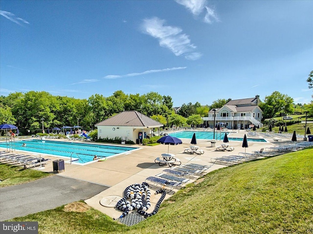 6341 Knollwood Dr, Frederick, MD 21701 - community pool with a patio area, a lawn, and view of scattered trees