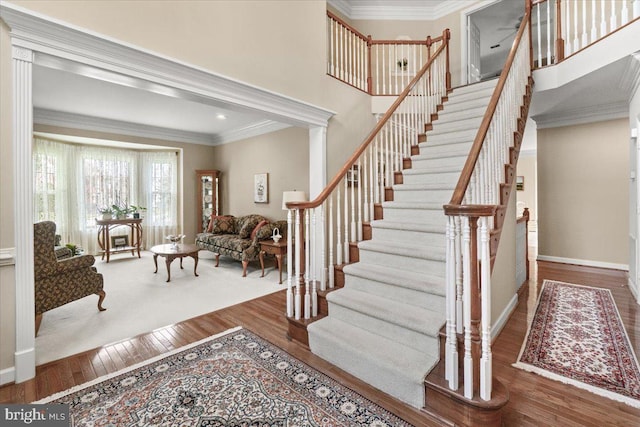 6341 Knollwood Dr, Frederick, MD 21701 - stairway with hardwood / wood-style flooring, crown molding, and baseboards