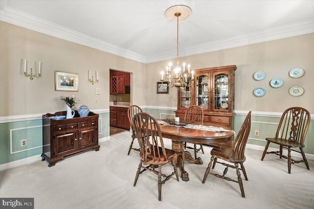 6341 Knollwood Dr, Frederick, MD 21701 - dining space with a chandelier, crown molding, light carpet, and wainscoting