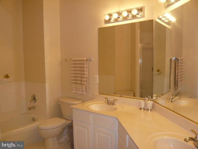 bathroom with a sink, toilet, and a bathtub