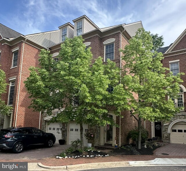 4906 Donovan Dr, Alexandria, VA 22304 - view of front facade with a garage, driveway, and brick siding