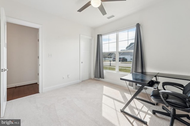 home office featuring visible vents, carpet, ceiling fan, and baseboards