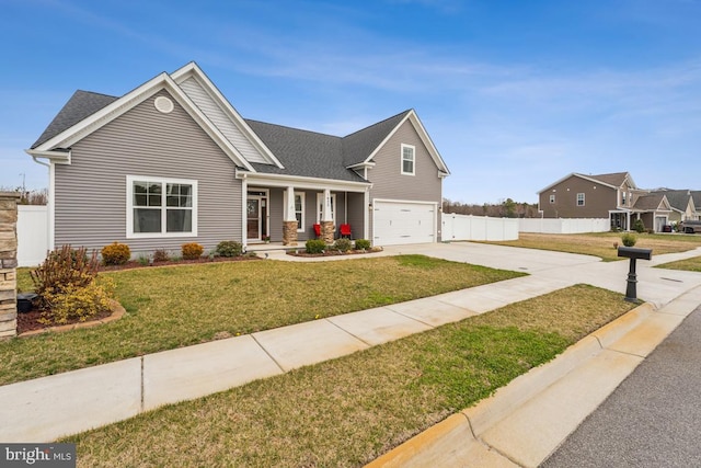 view of front facade featuring fence, a front lawn, a garage, covered porch, and driveway