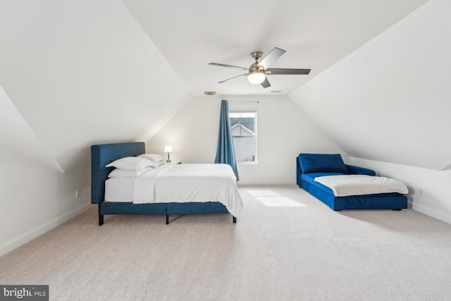 bedroom with baseboards, carpet flooring, ceiling fan, and vaulted ceiling