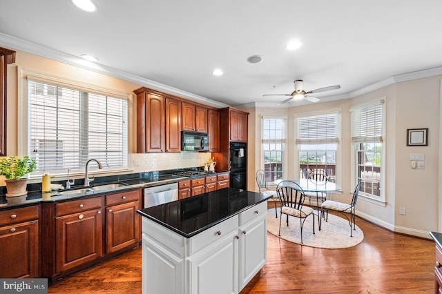 kitchen with black appliances, a sink, crown molding, ceiling fan, and dark wood-type flooring