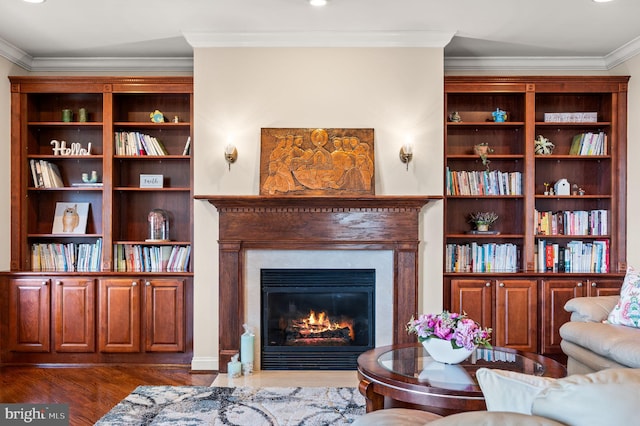 living area featuring dark wood finished floors, ornamental molding, and a fireplace with flush hearth