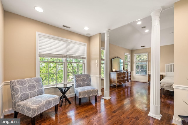sitting room featuring ornate columns, wood finished floors, lofted ceiling, and recessed lighting