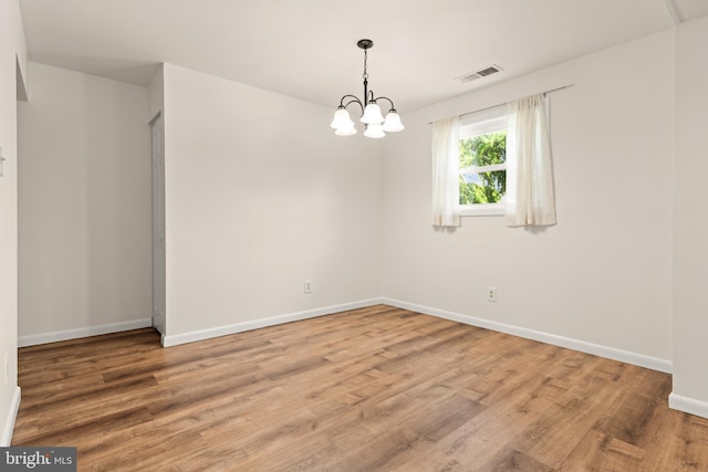 15 Warren Lodge Ct Unit 1D, Cockeysville, MD 21030 - spare room with wood finished floors and a chandelier