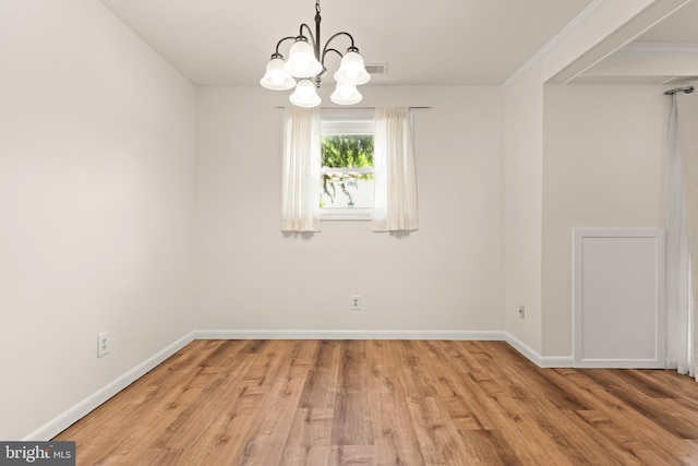 15 Warren Lodge Ct Unit 1D, Cockeysville, MD 21030 - unfurnished room featuring wood finished floors and a chandelier