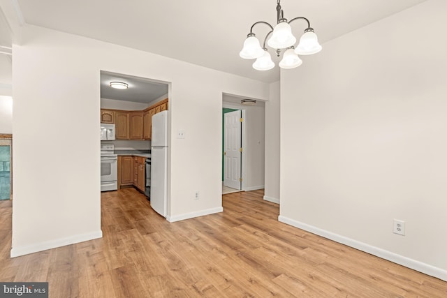 15 Warren Lodge Ct Unit 1D, Cockeysville, MD 21030 - unfurnished dining area with light wood finished floors and a chandelier