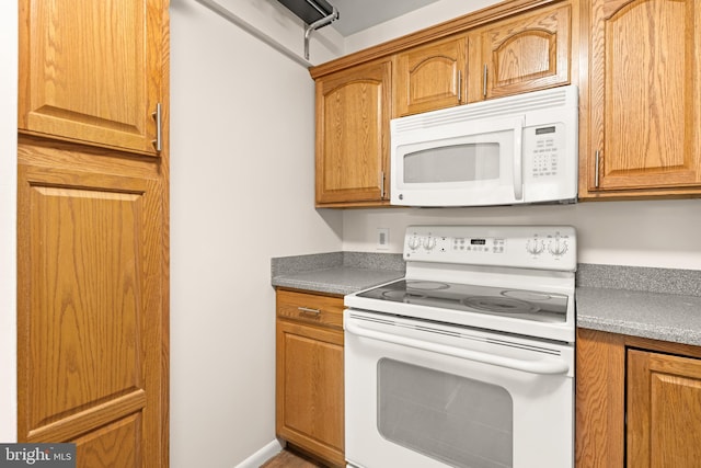 15 Warren Lodge Ct Unit 1D, Cockeysville, MD 21030 - kitchen featuring white appliances and brown cabinets
