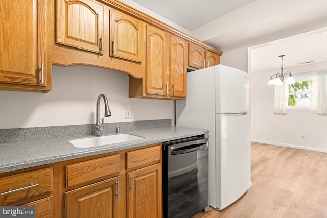 15 Warren Lodge Ct Unit 1D, Cockeysville, MD 21030 - kitchen featuring dishwasher, light wood-type flooring, a chandelier, and brown cabinetry
