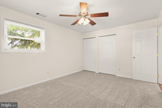 15 Warren Lodge Ct Unit 1D, Cockeysville, MD 21030 - unfurnished bedroom with two closets, carpet, and a ceiling fan