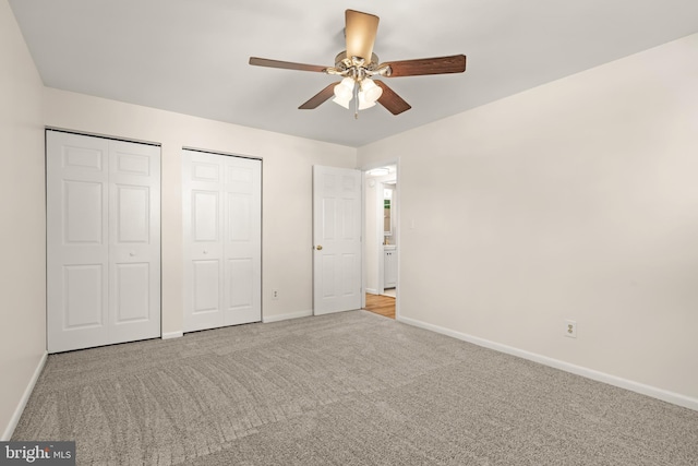 15 Warren Lodge Ct Unit 1D, Cockeysville, MD 21030 - unfurnished bedroom featuring two closets, carpet floors, and a ceiling fan